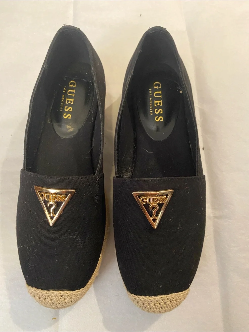 GUESS Black Espadrille Slip-On Flats with Gold Triangle Emblem